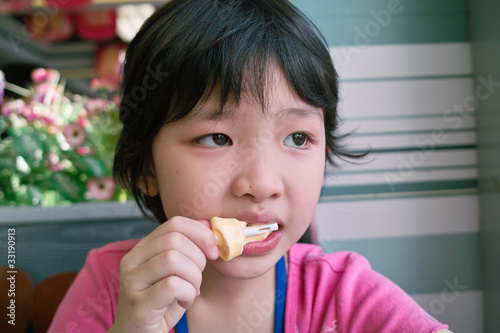 Asian kid eating