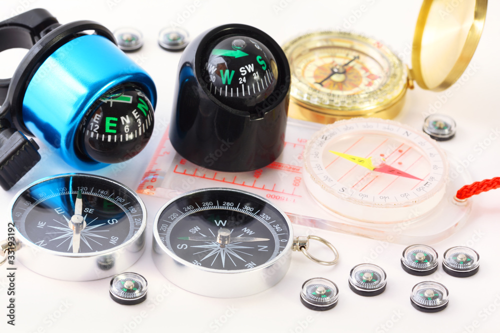 Fifteen different multi-colored compasses Fifteen different multi-colored compasses
