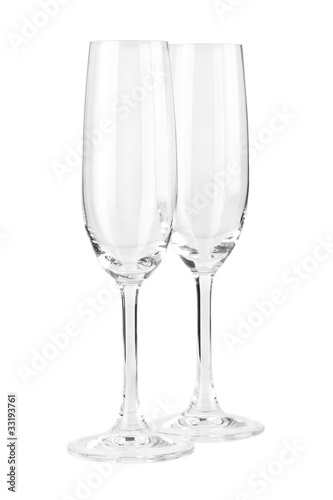 Two empty champagne glasses isolated on white