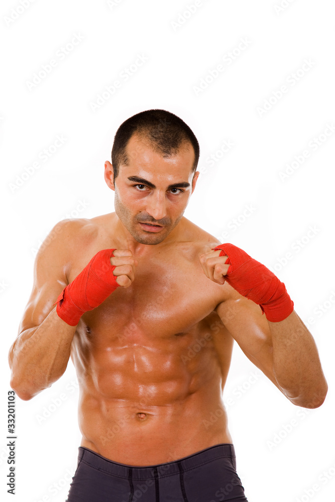 Portrait of young boxer man over white background