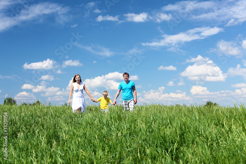 family with son on the meadow