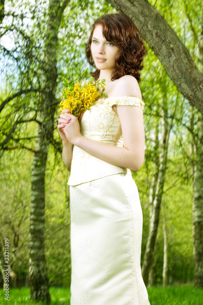 portrait of young girl with bunch of yellow flowers in wedding c portrait of young girl with bunch of yellow flowers in wedding c