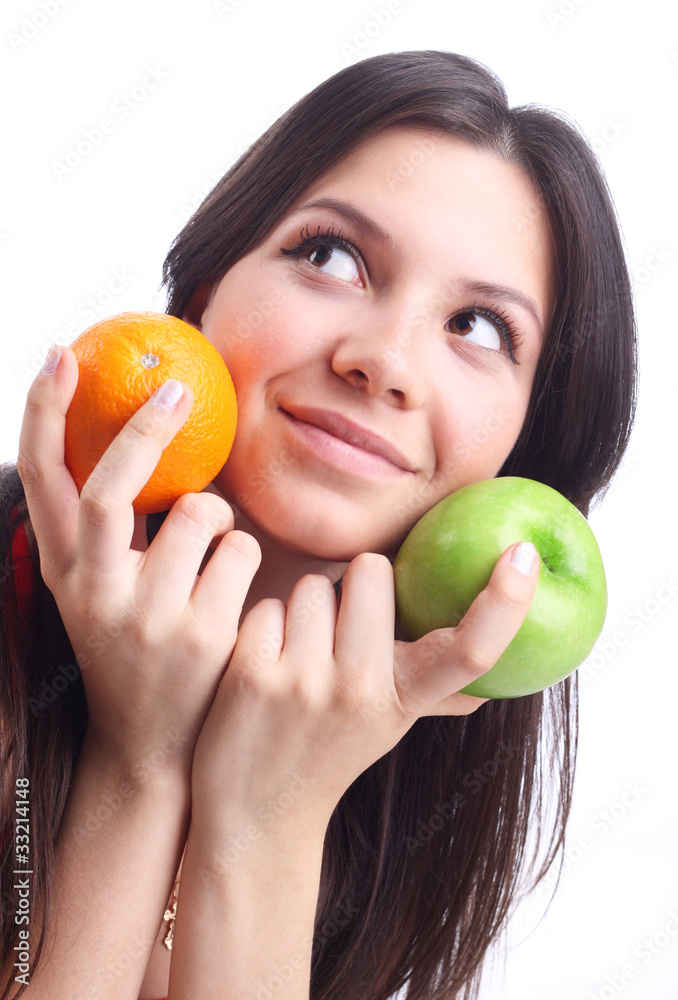 Young woman hold fruit - apple and orange. Isolated Young woman hold fruit - apple and orange. Isolated