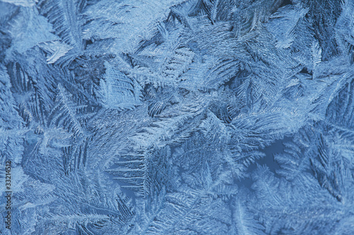 Frosty natural pattern at a winter window glass © elen_studio
