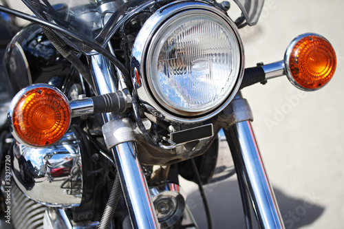 Part of motorcycle – headlight. Detail of Motorbike. Outdoors
