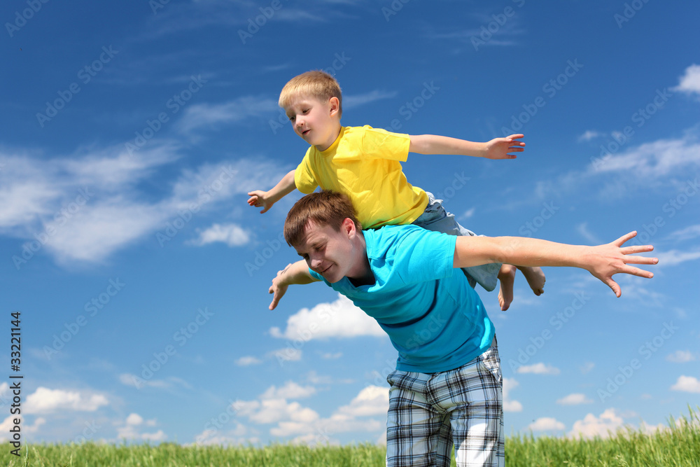 father with son in summer day outdoors father with son in summer day outdoors