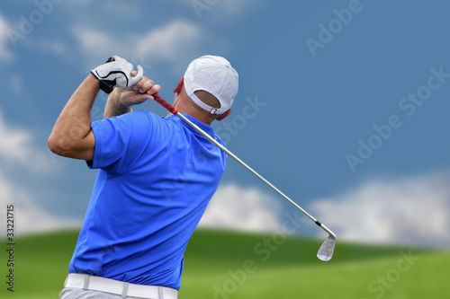 golfer shooting a golf ball
