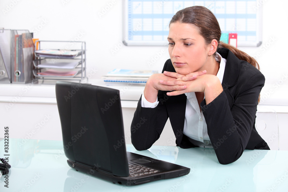 Brunette businesswoman bored at work Brunette businesswoman bored at work