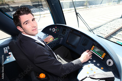 Young man driving a tram