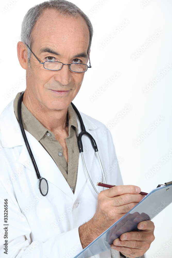Medical professional writing on a clipboard Medical professional writing on a clipboard