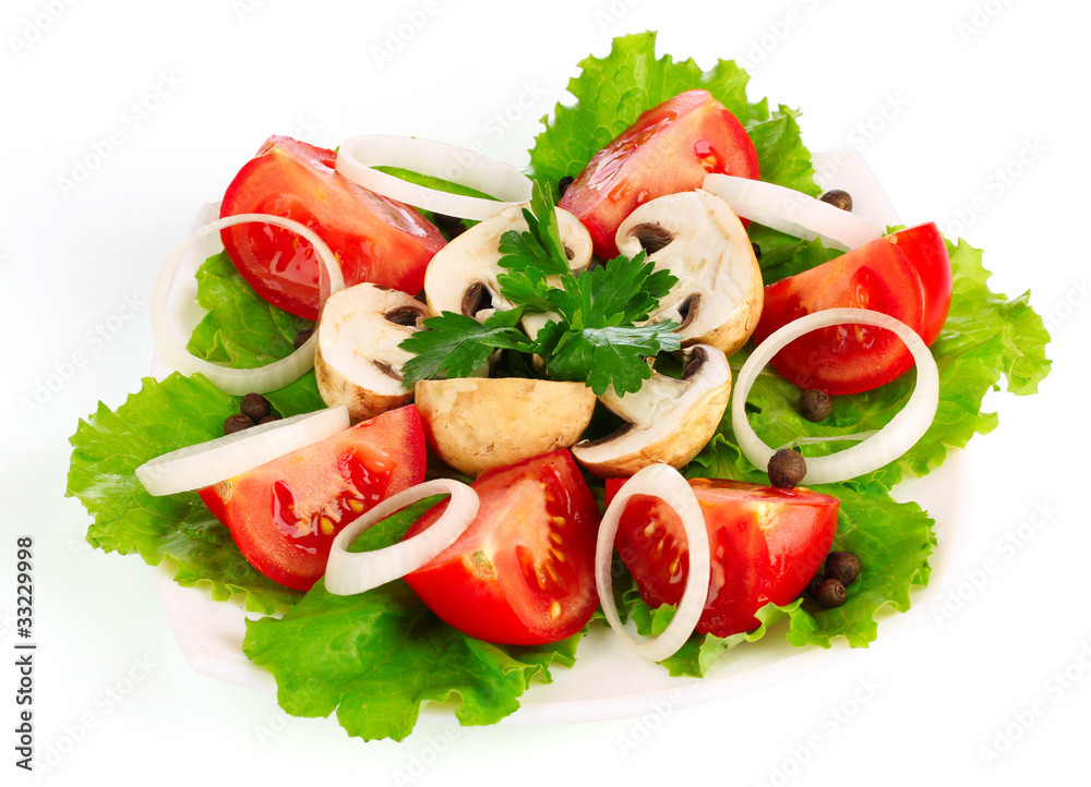 many vegetables on the plate isolated on white many vegetables on the plate isolated on white