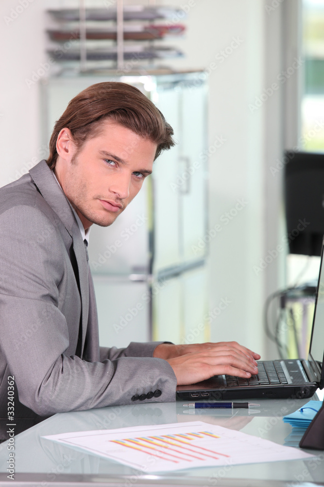 Young businessman on laptop Young businessman on laptop