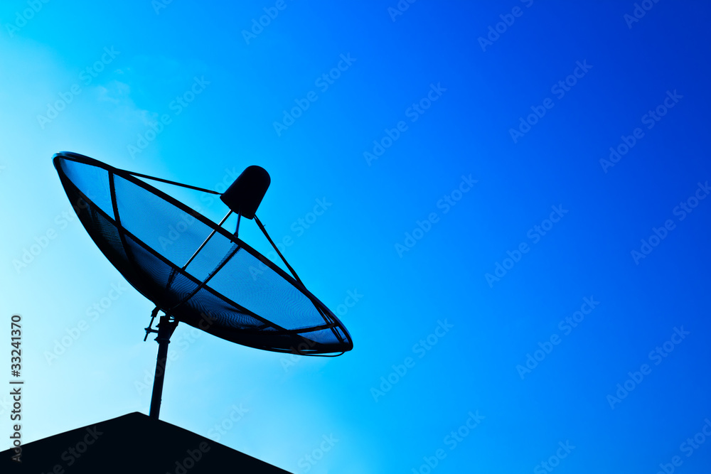 Satellite dish in blue sky