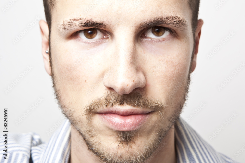 Obraz premium young man's face, intense look