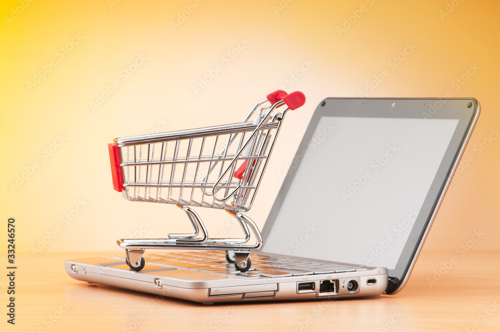 Internet online shopping concept with computer and cart