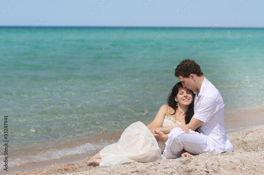 young loving couple on beach