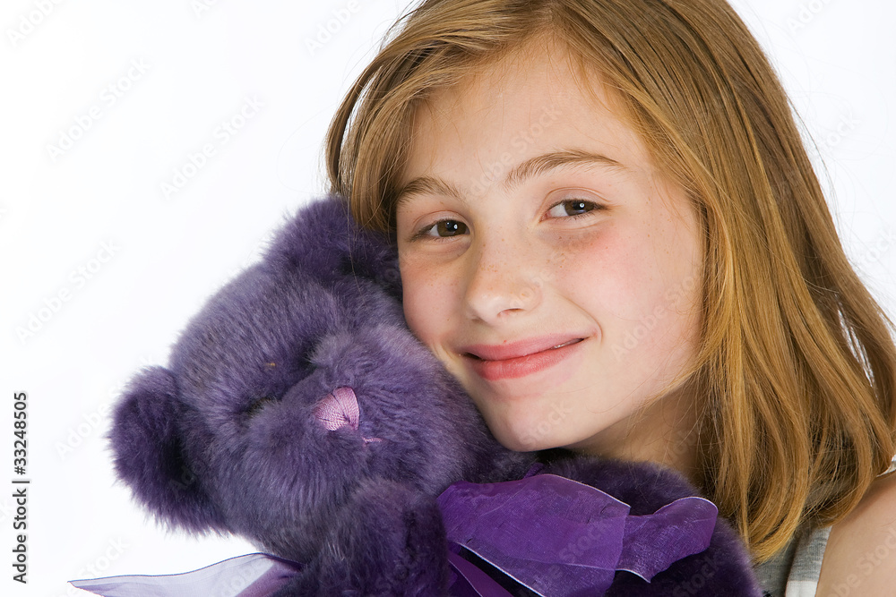 cute kid with a purple stuffed animal