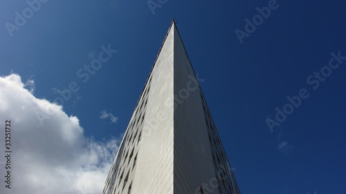 The Modern town building on background sky with cloud.