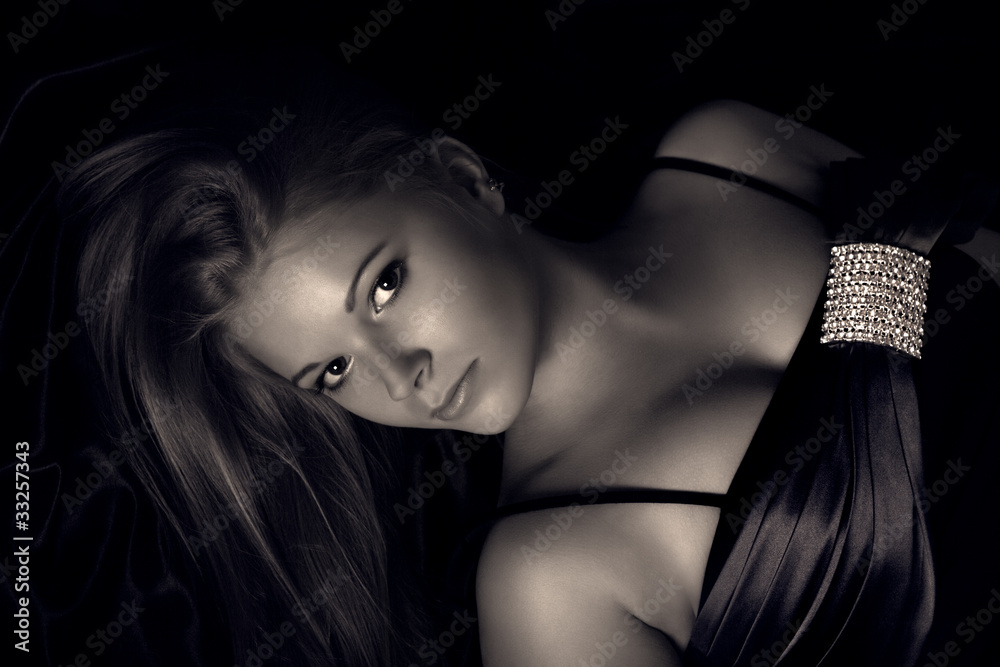 Portrait of a young woman on a dark background Portrait of a young woman on a dark background