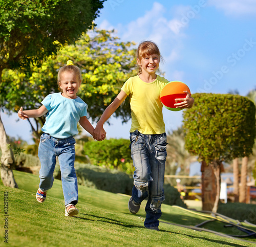 Children running in park.