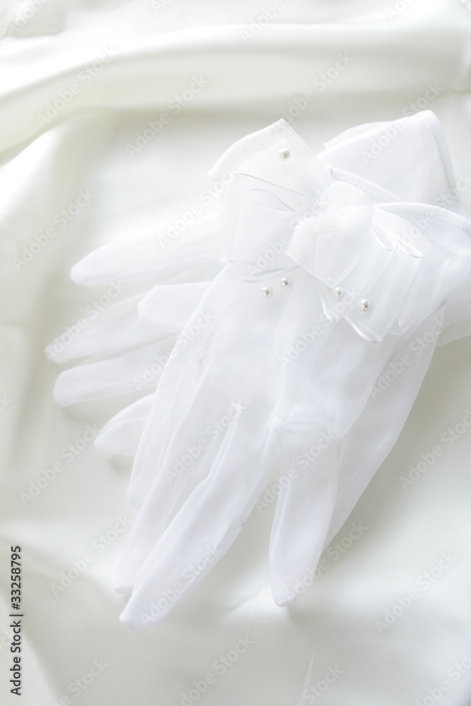 Bride gloves on white silk Bride gloves on white silk