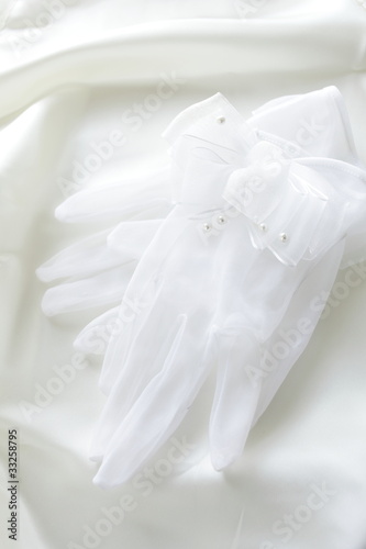 Bride gloves on white silk