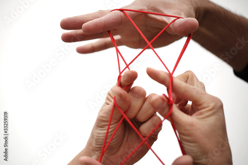 Hand und roter Faden