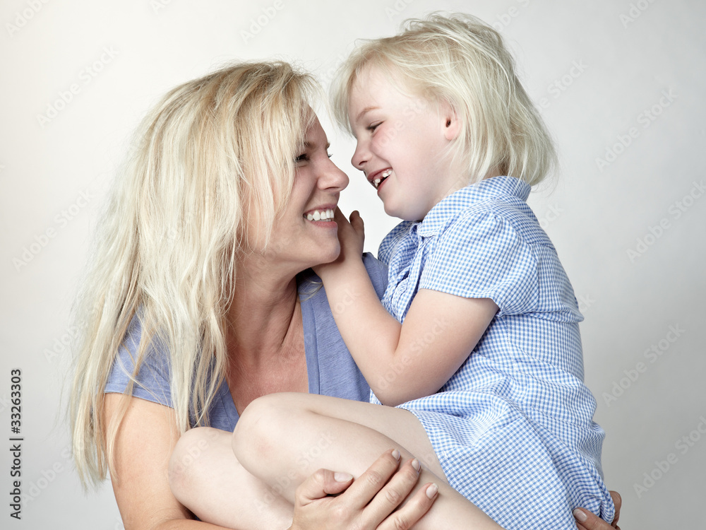 Blond mother and daughter having fun together Blond mother and daughter having fun together