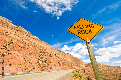 Falling rock sign next to the road