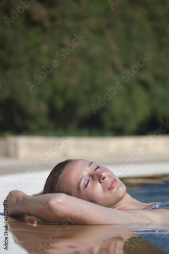 sunbathing in swimming pool