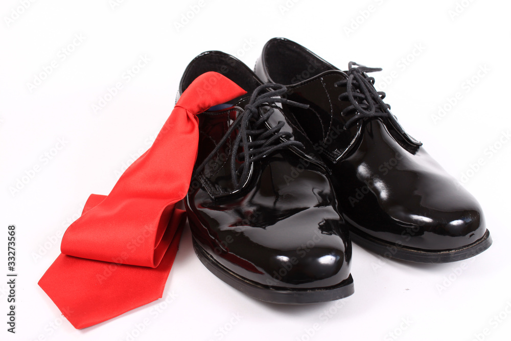 Shiny men's dressy shoes and red tie Shiny men's dressy shoes and red tie