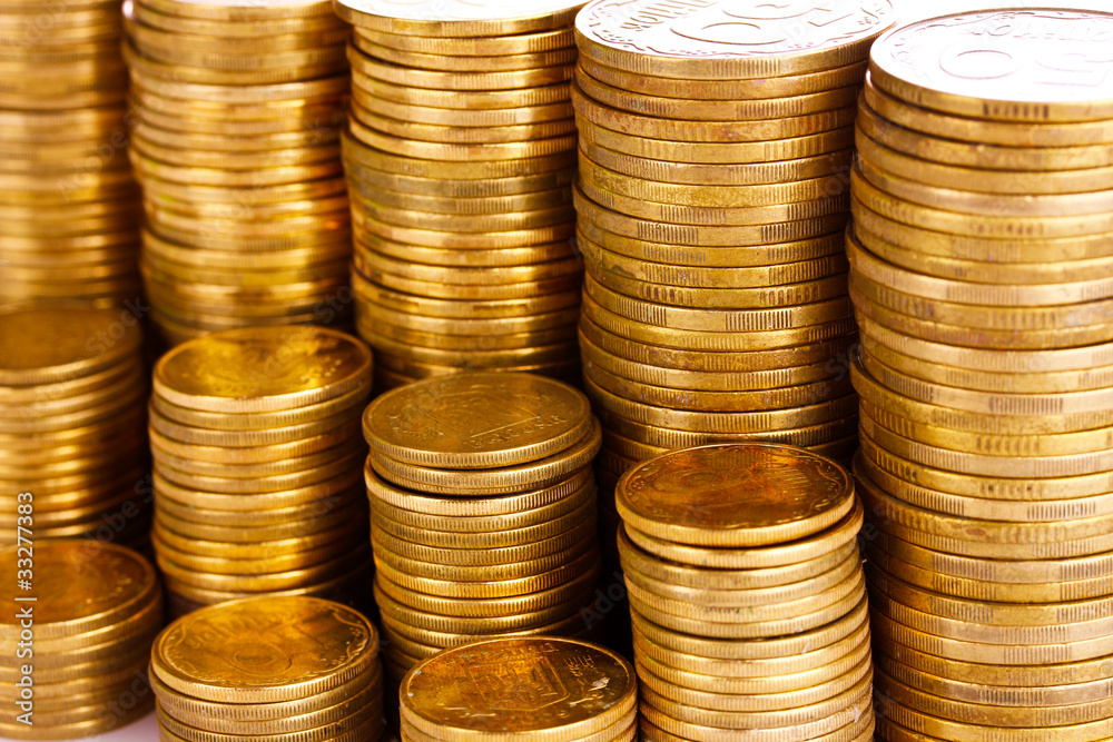 Many coins in columns isolated on white. Ukrainian coins Many coins in columns isolated on white. Ukrainian coins