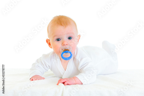 Tablou pe pânză Sweet  four month old  baby girl with soother laying on diaper.