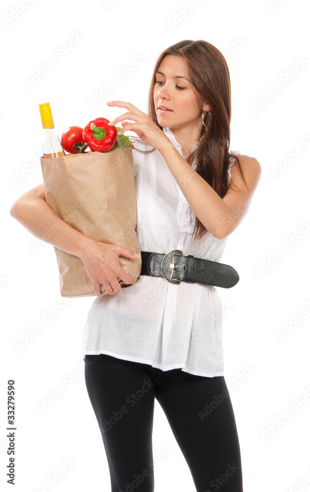 woman holding shopping paper bag full of vegetarian groceries, r woman holding shopping paper bag full of vegetarian groceries, r