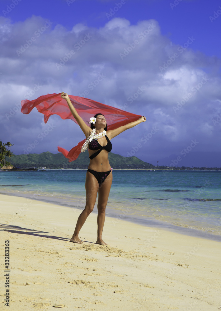 beautiful hispanic woman in bikini at the beach in hawaii