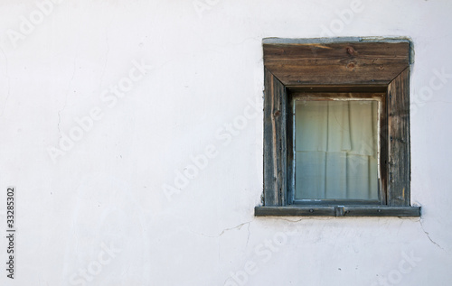 Old windows on the white wall