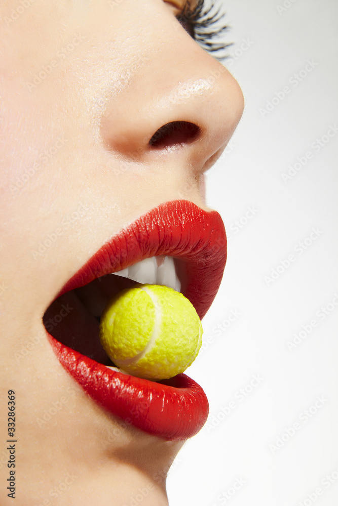 Naklejka premium lips bitting sugar tennis ball