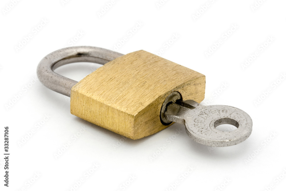 Padlock and key over white