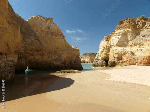 Colourful rocks and wonderful sands on the Algarve coast photo