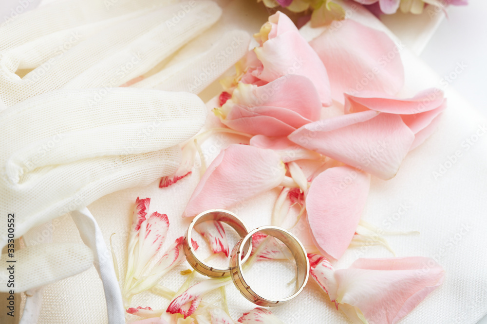 golden rings and rose petals