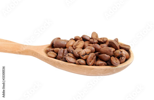 Coffee beans in wooden spoon, isolated on a white background