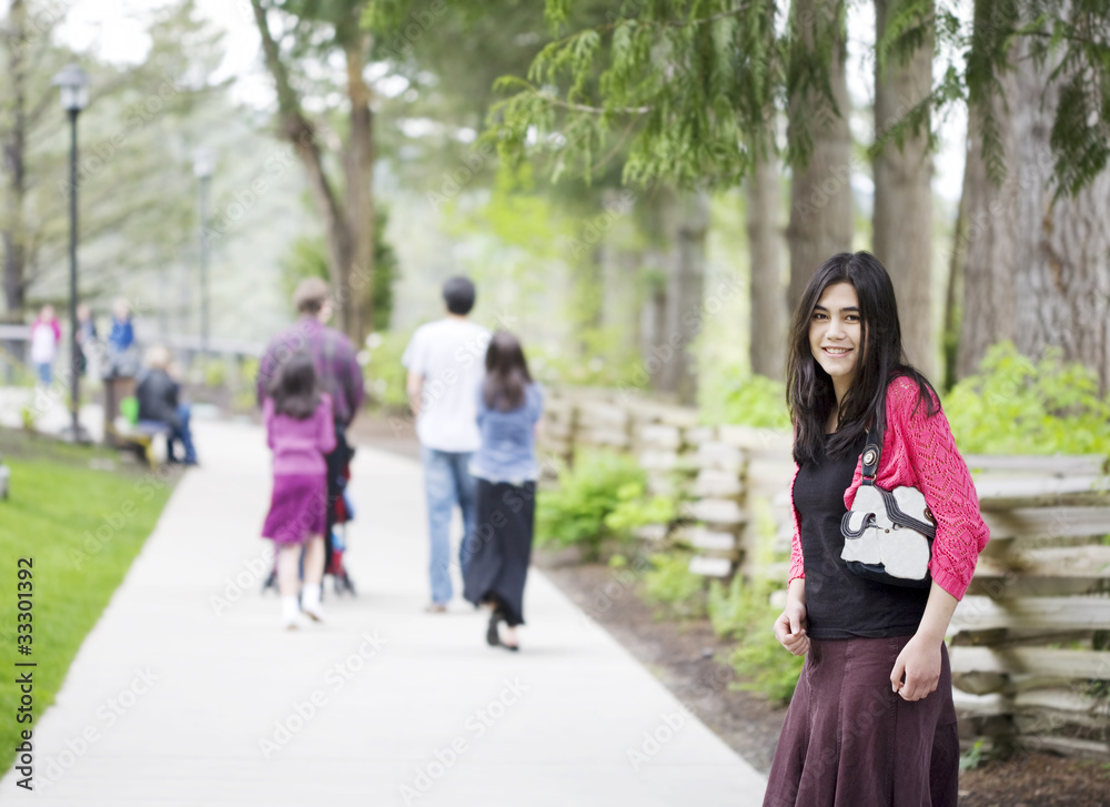 Beautiful teenage girl out on walk with family Beautiful teenage girl out on walk with family