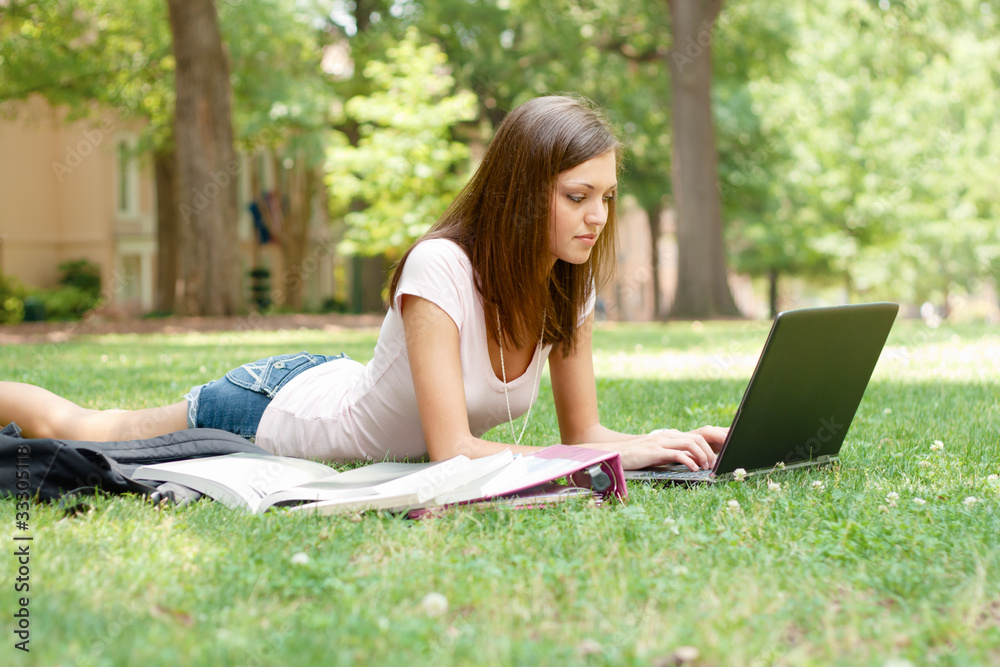 A pretty young student with study materials A pretty young student with study materials