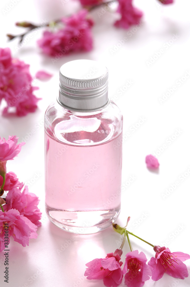 spa pink liquid and pink branch, cherry flower spa pink liquid and pink branch, cherry flower