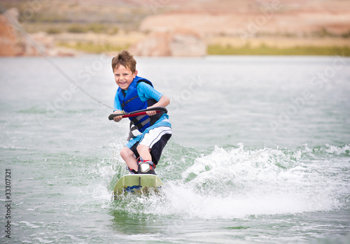 Young Boy learning to Wakeboard photo
