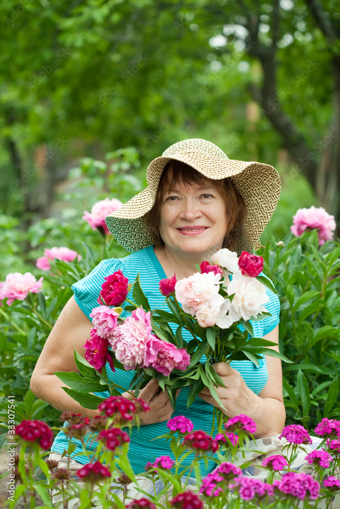 Happy mature woman at garden