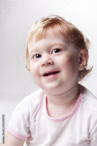 happy baby on gray background