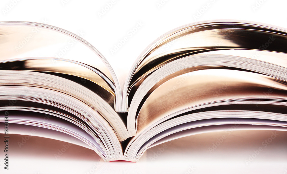 Pile of open magazines isolated on white background Pile of open magazines isolated on white background