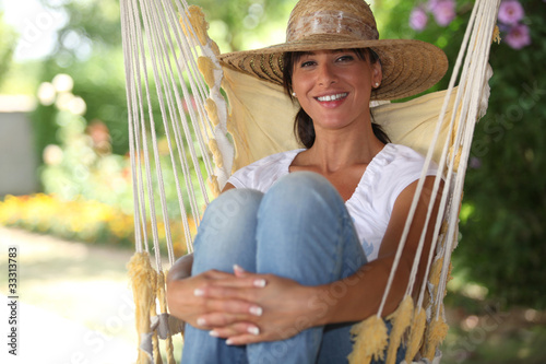 Woman sat in a hammock