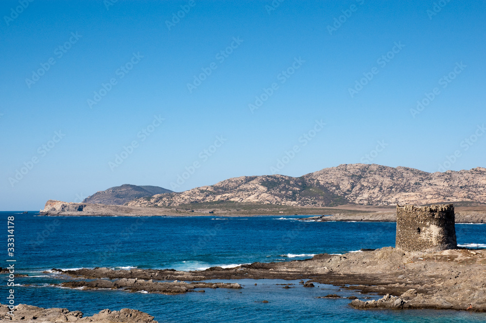 Fototapeta premium Sardinia, Italy: Stintino, spanish tower near La Pelosa Beach